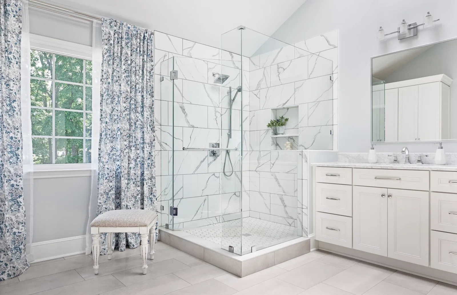 Marble look tile walk in shower installation with custom glass enclosure, bathroom remodeling Fort Myers FL