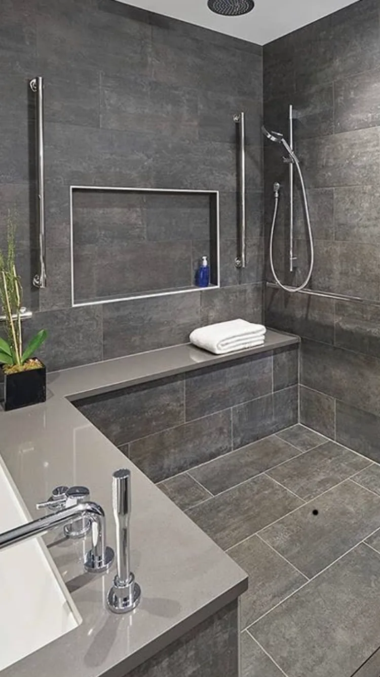 Walk in tile shower with bench and custom niche installed by Dynasty Tile, tile contractor Cape Coral FL